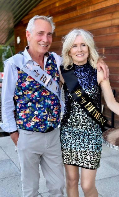 2025 Mature modelling couple dressed for 70th birthday celebration in evening lifestyle portrait